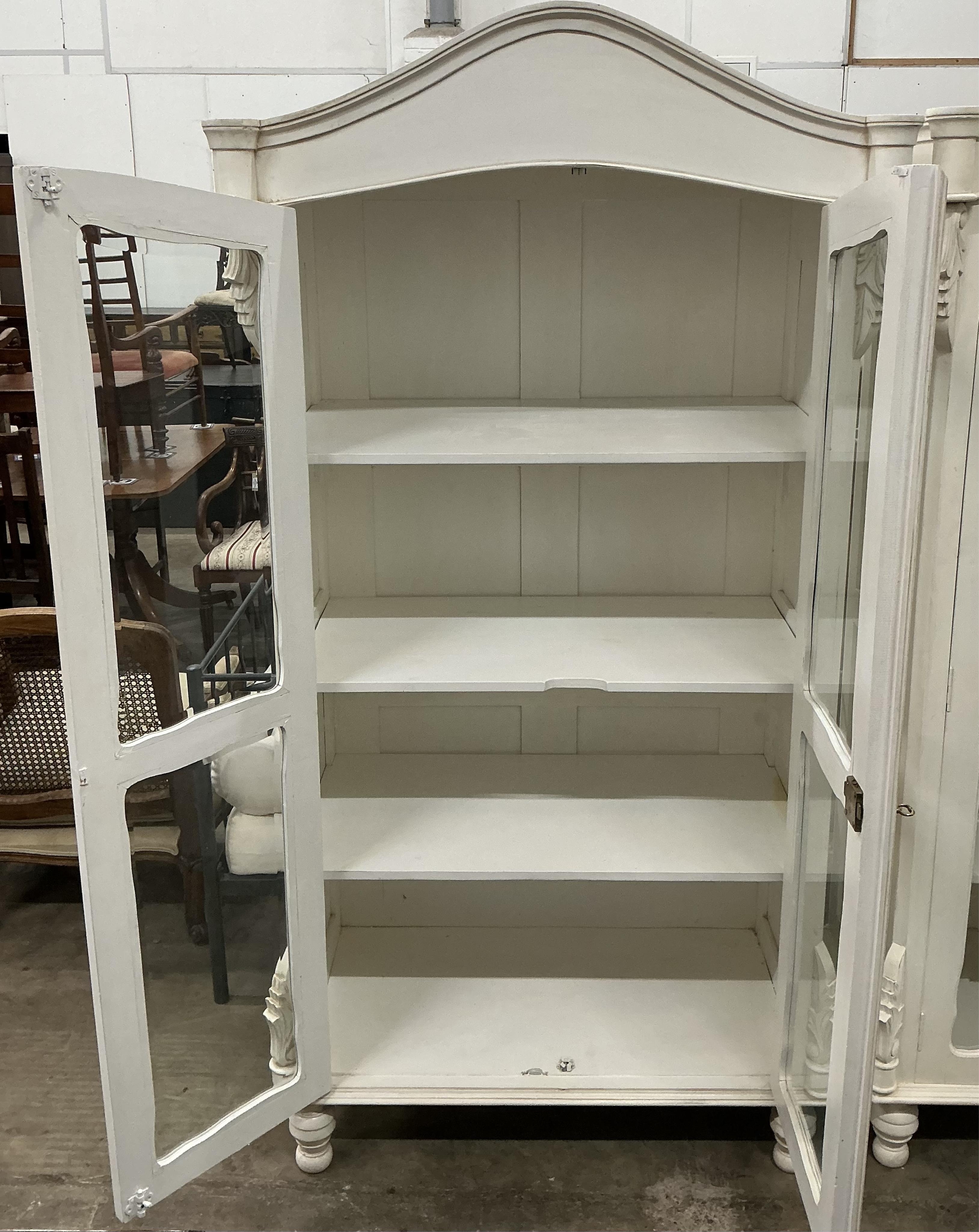A pair of modern French Provincial style white painted two door glazed display cabinets, width 102cm, depth 54cm, height 185cm